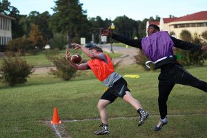 college students playing flag football