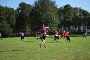 college students playing flag football