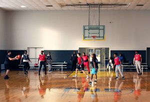 students playing basketball