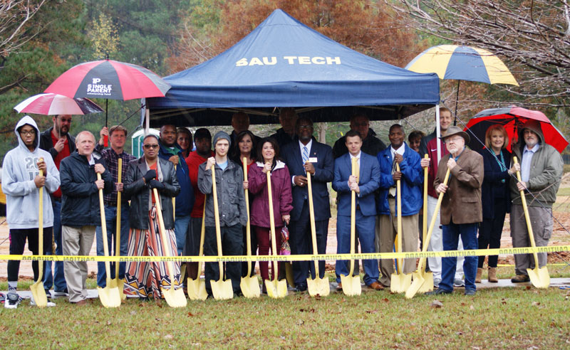 group of people with shovels