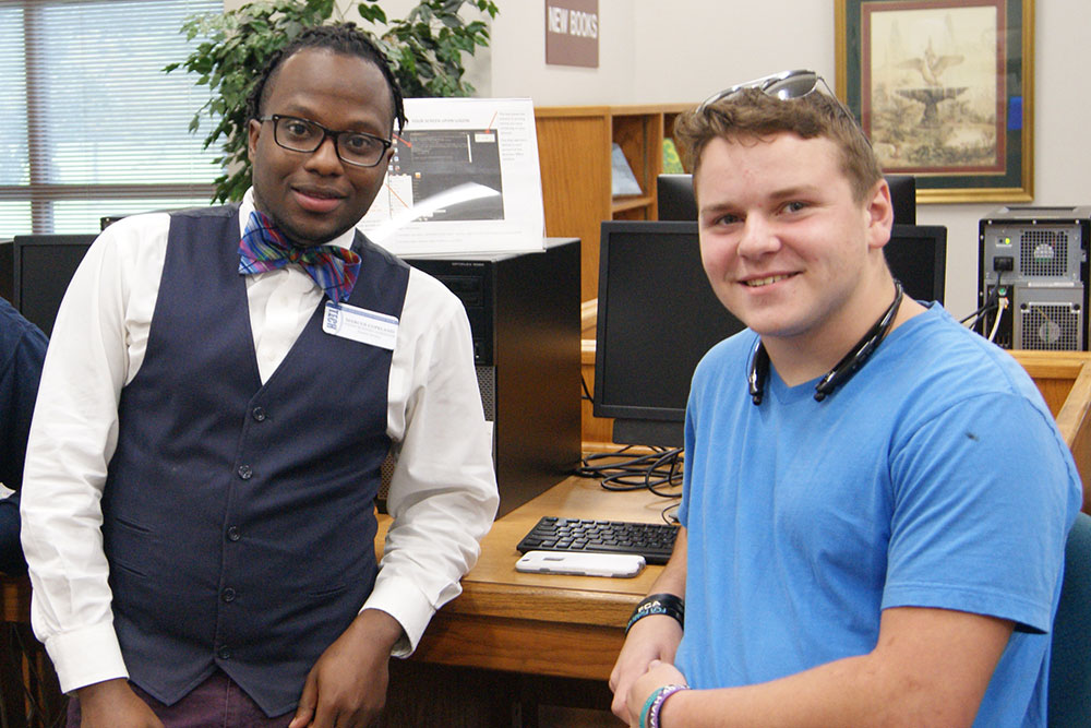 black male and white male smiling
