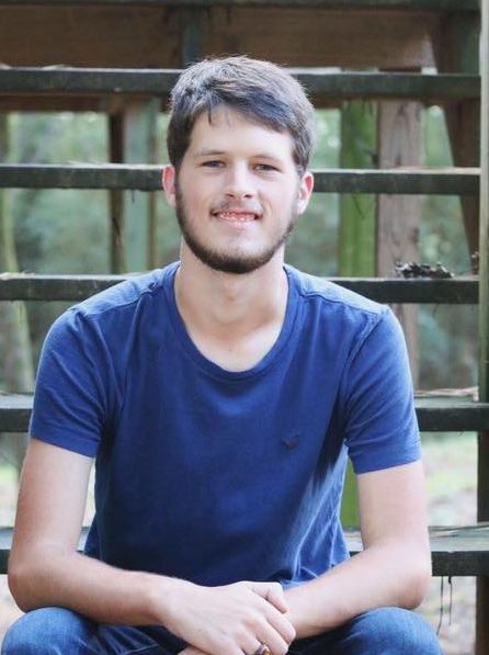 young white male sitting on steps