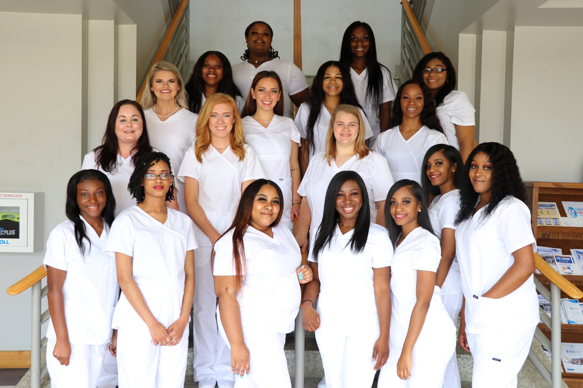 nursing graduates in white