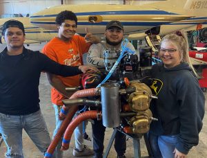 group of students with airplanes