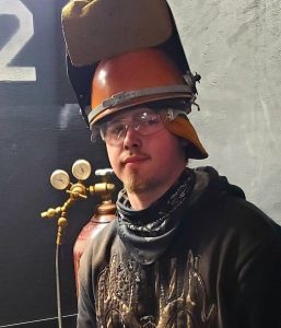 Man in welding helmet