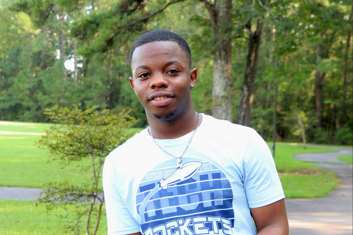 young man in blue t-shirt