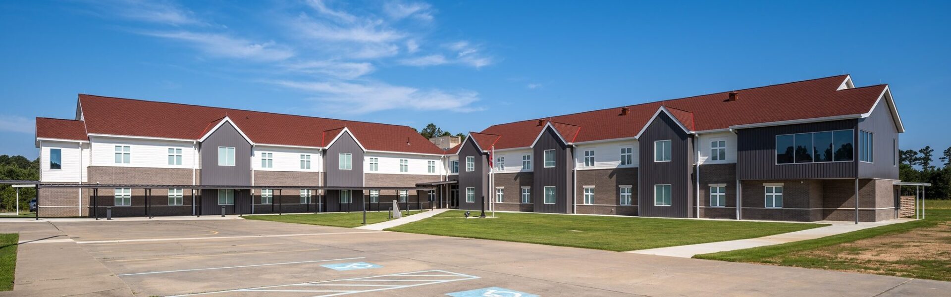 outside of new residence halls with red roofs