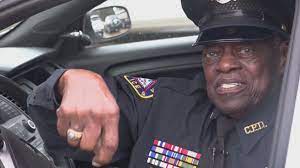 a older man in a police uniform