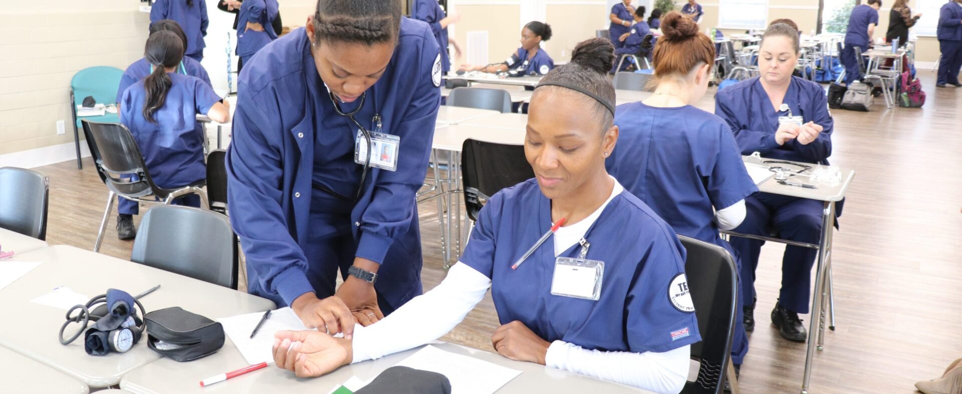 group of nursing students practicing