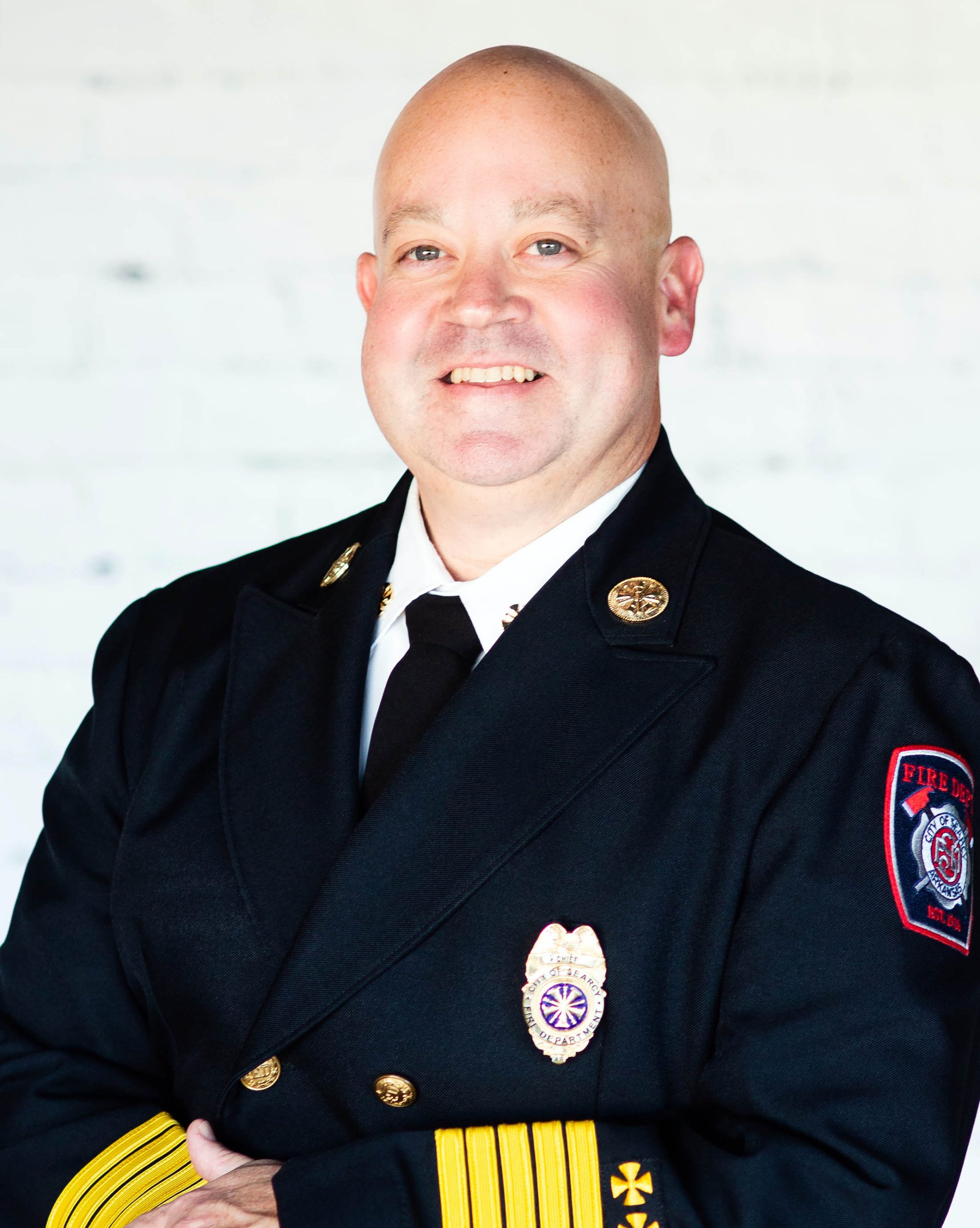 man smiling in fire officer uniform