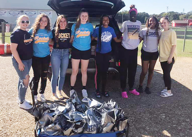 group of students with goody bags for teachers