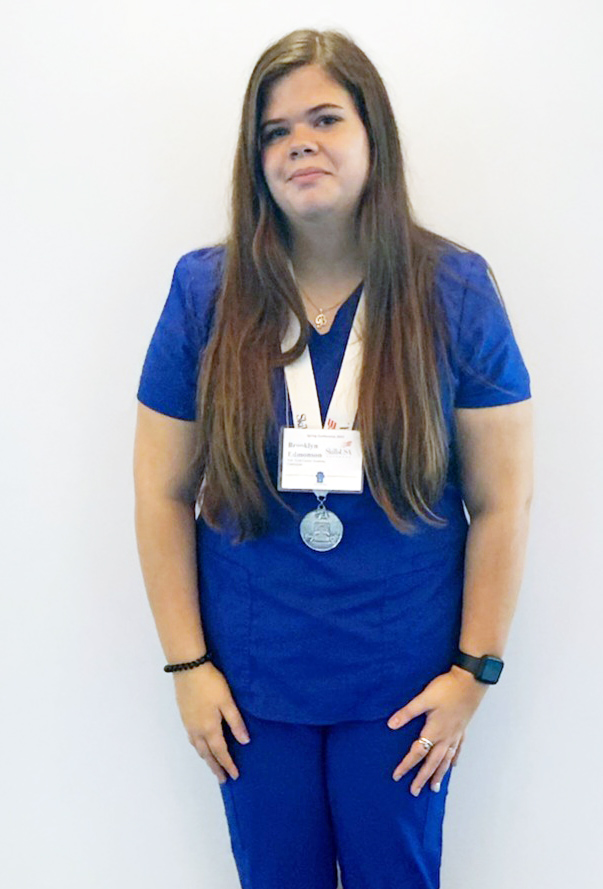 young woman in blue scrubs