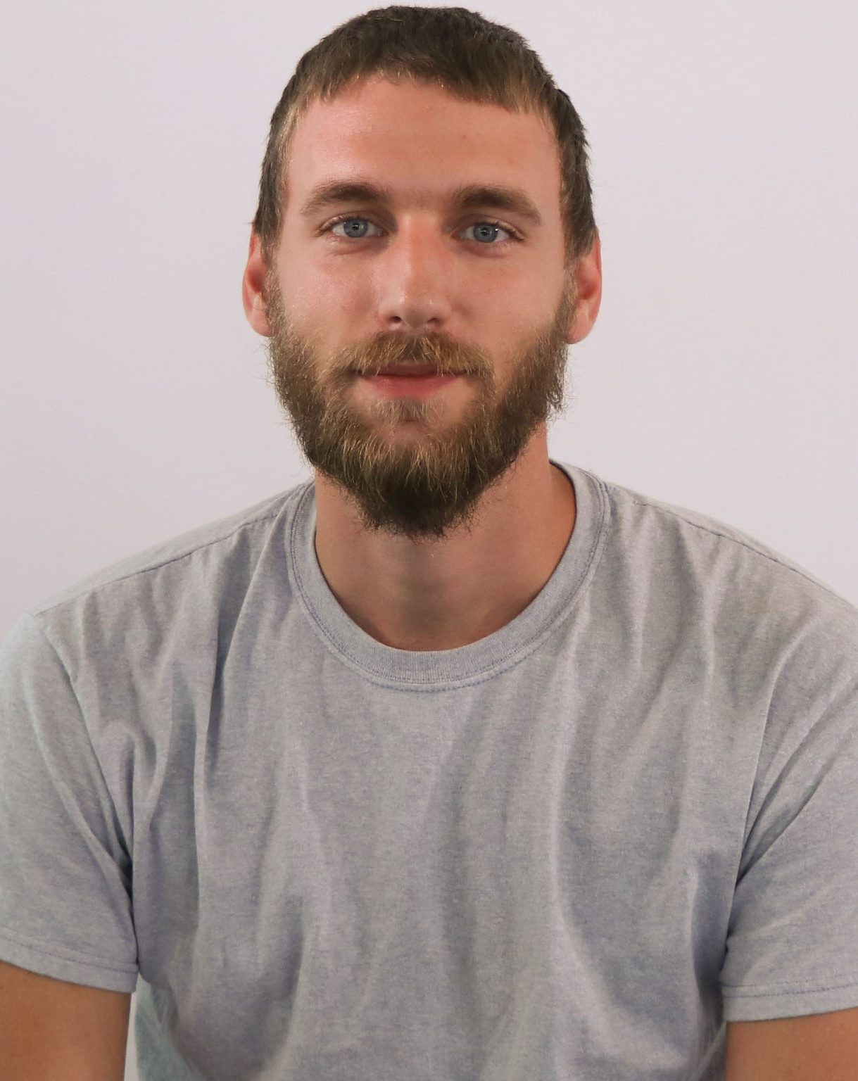 white male with light gray shirt and beard