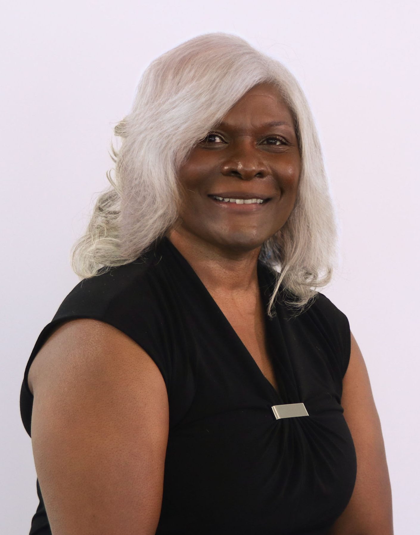 woman with gray hair in a black shirt