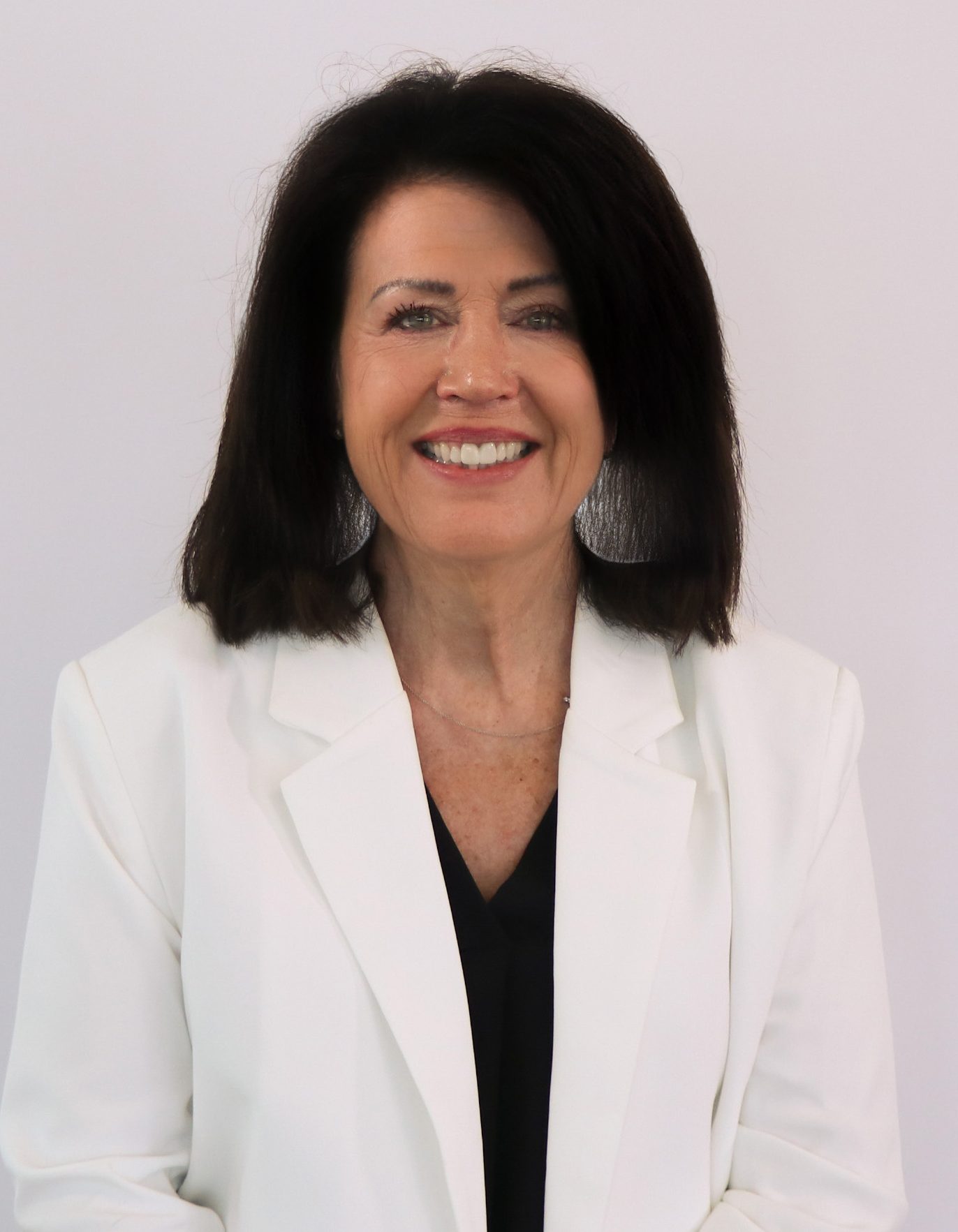 woman wearing a white jacket with black hair