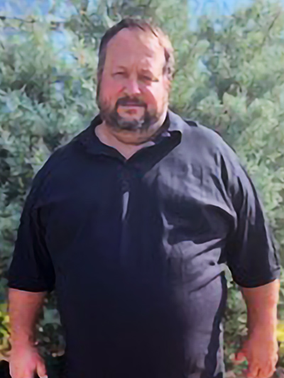 Man in black polo shirt
