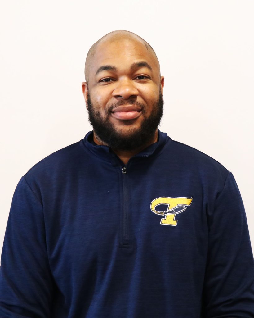 Smiling bearded man in blue sweatshirt