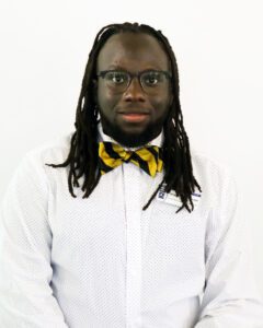 young man wearing glasses and a bow tie
