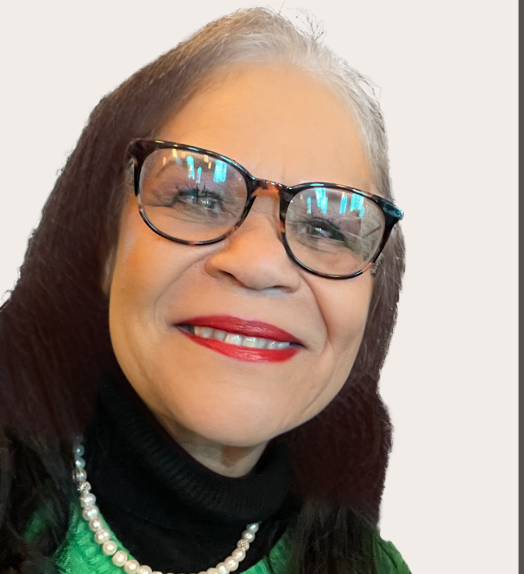 woman with glasses in a green sweater