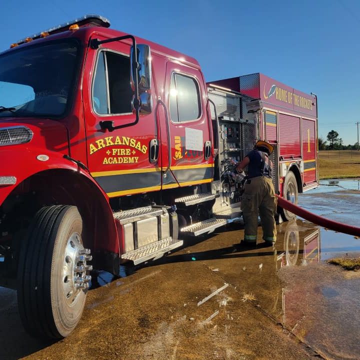 Fireman washing a fire truck